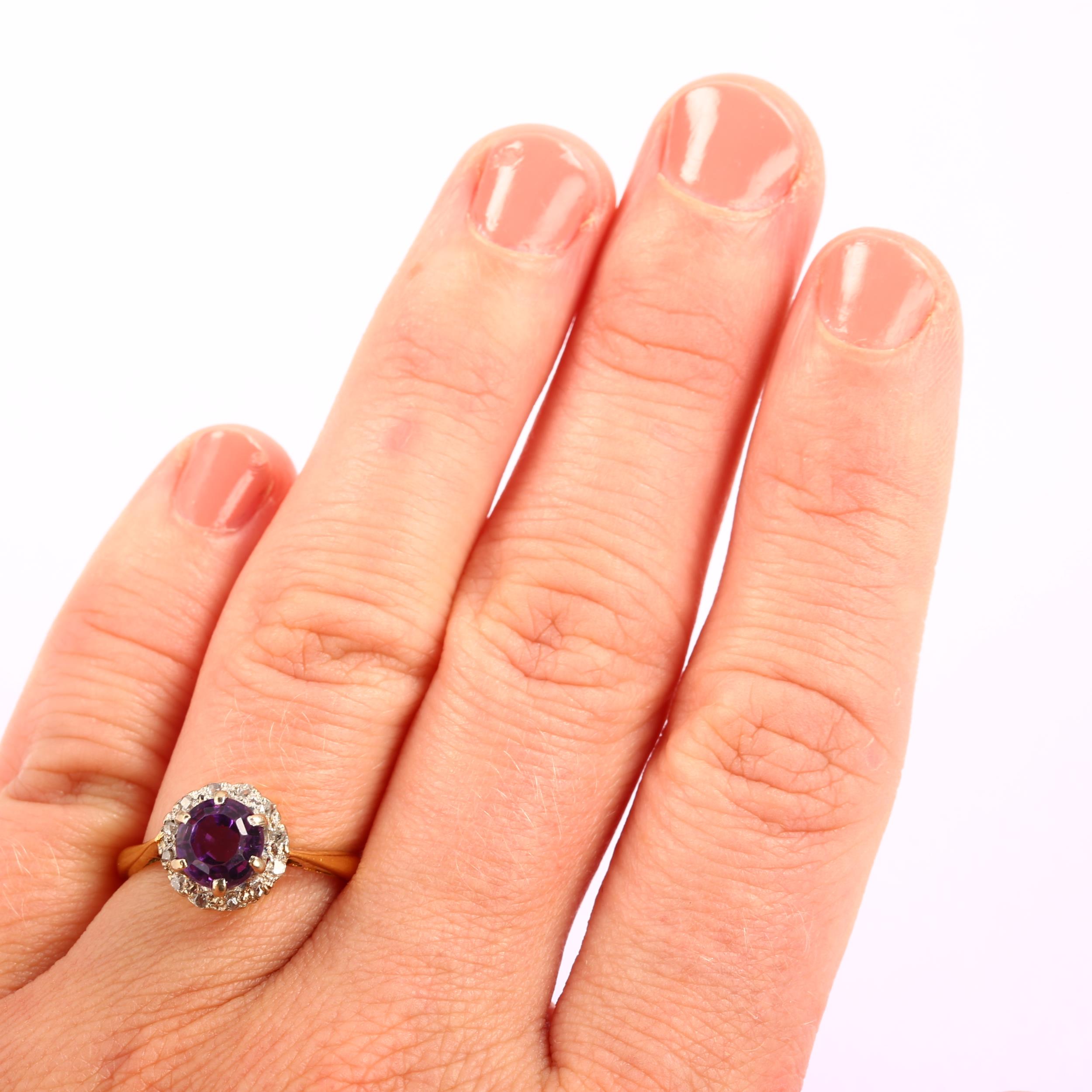 A mid-20th century 18ct gold amethyst and diamond circular cluster ring, set with round step-cut - Image 4 of 4