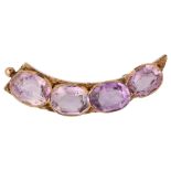 An Antique amethyst cornucopia brooch, unmarked gold settings with oval mixed-cut amethysts, 44.6mm,
