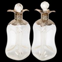 A pair of George V silver-mounted pinch glass glug glug decanters, indistinct maker, London 1908,