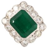 A large mid-20th century 18ct white gold emerald and diamond rectangular cluster ring, set with