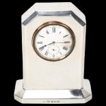 An Art Deco George V silver mantel clock, Spurrier & Co, Birmingham 1924, white enamel dial with