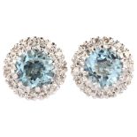 A pair of aquamarine and diamond round cluster earrings, unmarked white metal settings with round-