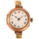 An early 20th century 9ct rose gold Officer's trench style mechanical wristwatch, white enamel