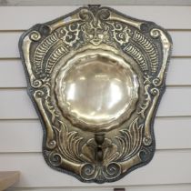 An Antique Dutch brass shield-back wall sconce, stylised repousse decoration, L57cm