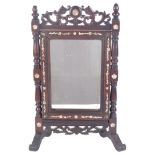 A Chinese padouk wood dressing table mirror, with carved and pierced frieze, and floral mother-of-