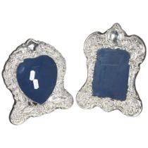 2 Elizabeth II silver-fronted photo frames, both having scrolled and embossed decoration, by Carr