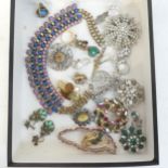 A nice collection of costume brooches, including a silver backed example, a Scottish design brooch.