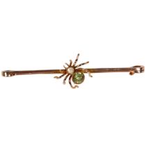 A 9ct gold bar brooch, surmounted by a pearl and peridot decorated spider