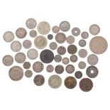 A group of various silver and other coins, including a 1933 crown, French and English