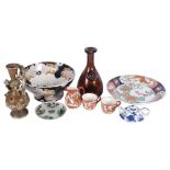 A group of modern Oriental ceramics, including a large plate with floral and mythical bird