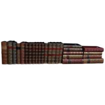 A collection of half leather-bound tooled and gilded Antique books, including Emerson's Works