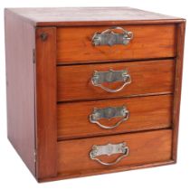 An Edwardian walnut table-top Wellington chest, with 4 short drawers, bearing label for Stones