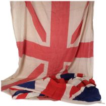 A printed cotton Union Jack, L176cm, and a printed white and red Union Jack flag