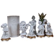 A group of Parian Ware bisque cherub figures, 2 glazed Continental figures, a Worcester vase of