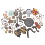 A collection of various collectables, including badges, some silver, lead plaque etc