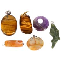 A group of stone and agate pendants, including 2 tigers eye examples, carnelian, amethyst, etc (6)