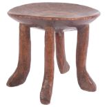 An Antique African carved hardwood stool, with shallowed seat, diameter 24cm, height 22cm