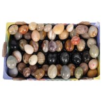 A large collection of stone eggs, including various onyx etc, approx 50 in total, varying sizes