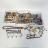 A collection of vintage and other costume jewellery, to include a 9ct gold front and back locket...