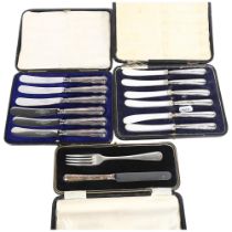 2 cased sets of 6 silver-handled butter knives, and a cased silver-handled and plated fork set (3)