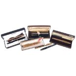 Vintage ballpoint pens and fountain pens, including Parker and Cross