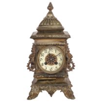 An ornate gilt-bronze mantel clock, 8-day movement striking on a gong, raised on cast feet, H35cm (