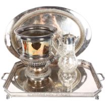 A rectangular 2-handled oval serving tray, a large fluted Champagne/ice bucket, and a Claret jug