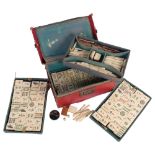 A 20th century Chinese bone and bamboo Mahjong set, complete with collection of bone sticks etc,