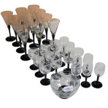 A set of 12 Art Deco style black and white glasses, and a set of 19 engraved Art Deco goblets and