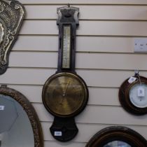 An Art Nouveau oak-framed aneroid barometer with thermometer, by Kendal & Dent, L77cm