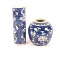 A Chinese blue and white sleeve vase with prunus decoration, H20cm, with 4 character mark to the