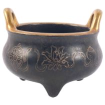 A Chinese bronze 2-handled censer, with gold engraved decoration and character mark to the base,