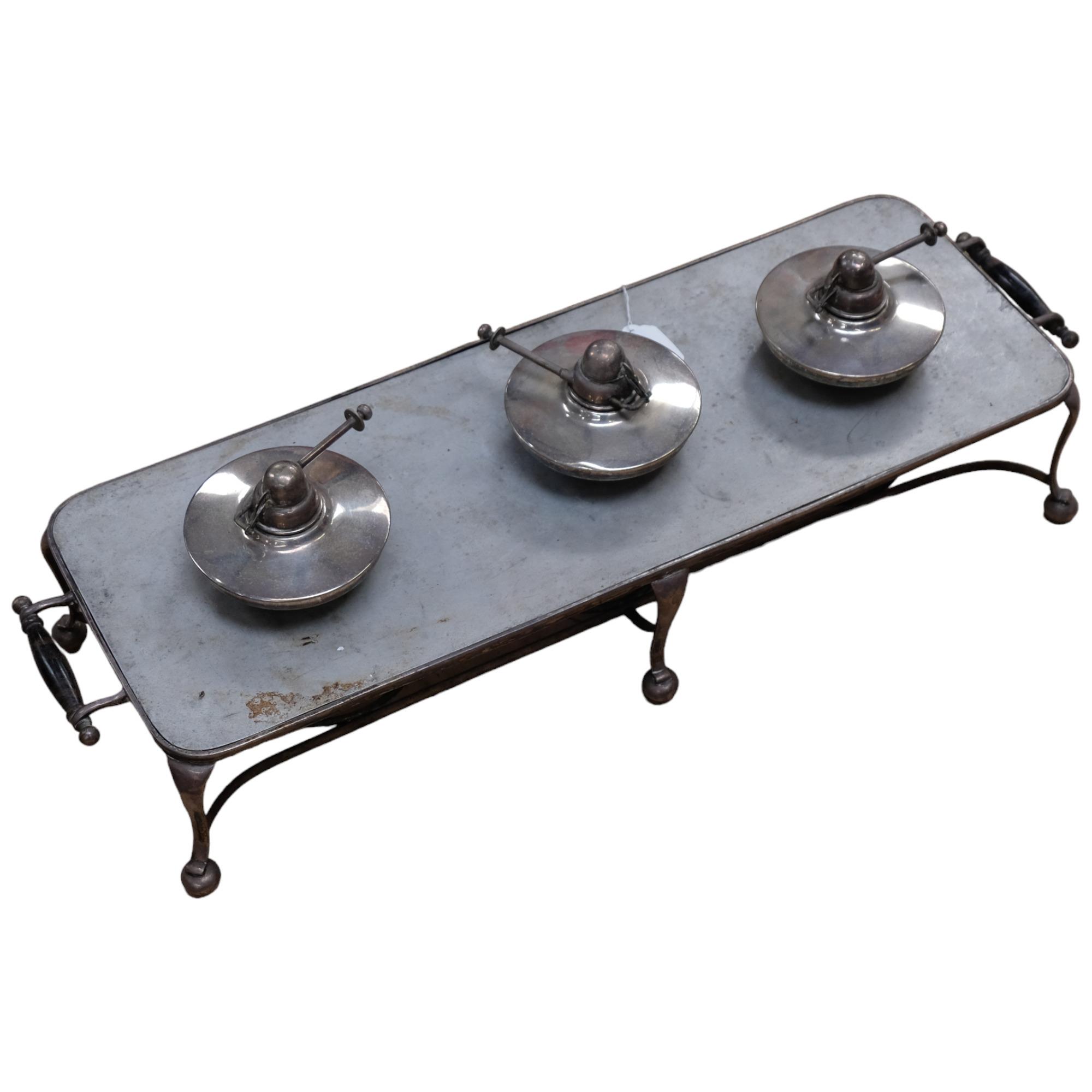 A silver plated warming stand, with turned wood handles, L71cm, and 3 silver plated burners