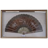 Antique fan with engraved and painted wooden sticks, floral decorated fabric screen, mounted in