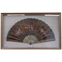 Antique fan with engraved and painted wooden sticks, floral decorated fabric screen, mounted in