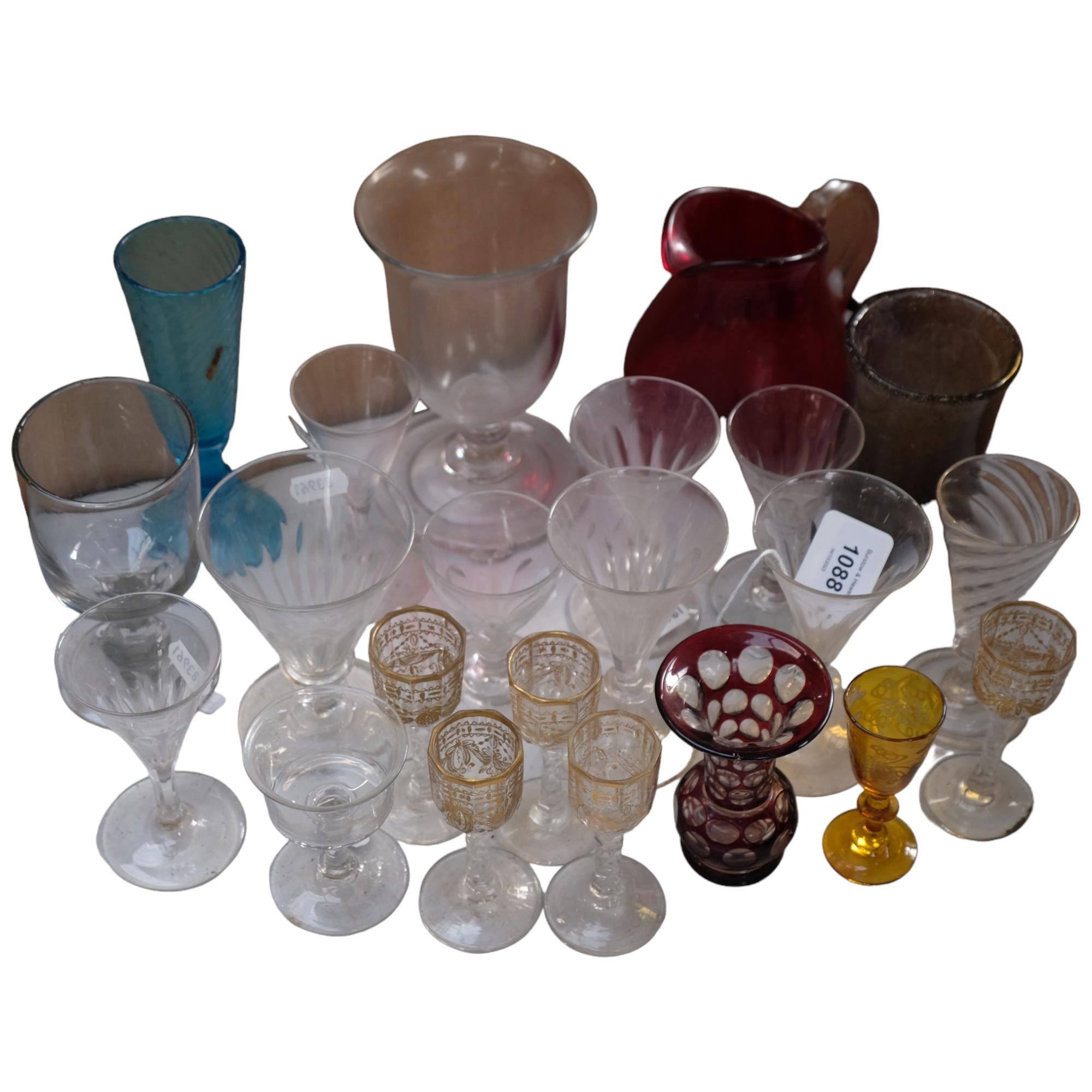 5 gilded panel cut liqueurs, ruby overlay vase, 10cm, a hand blown vase, and a Whitefriars ruby jug,