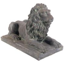 A terracotta lion sculpture on plinth, with verdigris finish, L39cm overall