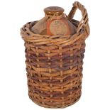 Vintage stoneware flagon and contents (unknown) in basket, H33cm
