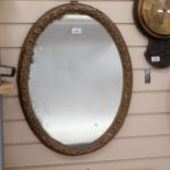 19th century giltwood and gesso oval wall mirror, H65cm