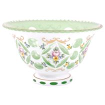 A Bohemian green and white enamel glass table centre bowl, with floral and gilded decoration,
