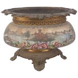 An Antique Continental ceramic pot with painted lake view, with cast-metal rim and feet