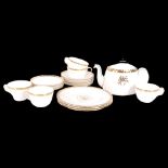 A Minton "gold rose" part tea set and dinner service, including 5 tea cups and saucers, teapot and