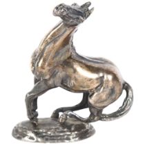 A cast solid silver model of a horse "playing up", by Lorne McKean, with hallmarks for John Pinches,
