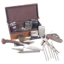 A collection of various items, including various lighters, horn-handled knife, tuning fork, silver-