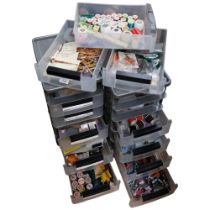 2 stacks of plastic containers, containing sewing equipment, cotton reels, patterns, and related