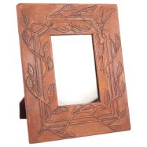 LIBERTY - a foliate embossed leather-covered photo frame with strut support, W23cm, H29cm, photo
