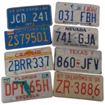 A collection of 8 American State number plates, including Oklahoma, Texas, Nevada, Utah, Florida,