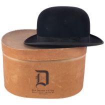 A bowler hat by G A Dunn & Co, in original hard hatbox