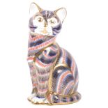 A Royal Crown Derby paperweight in the form of a seated cat, red back stamp and gold stopper, H13cm
