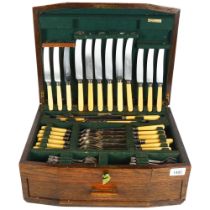 A mixed canteen of plated cutlery, various makers and designs, presented in a oak drawer-fitted